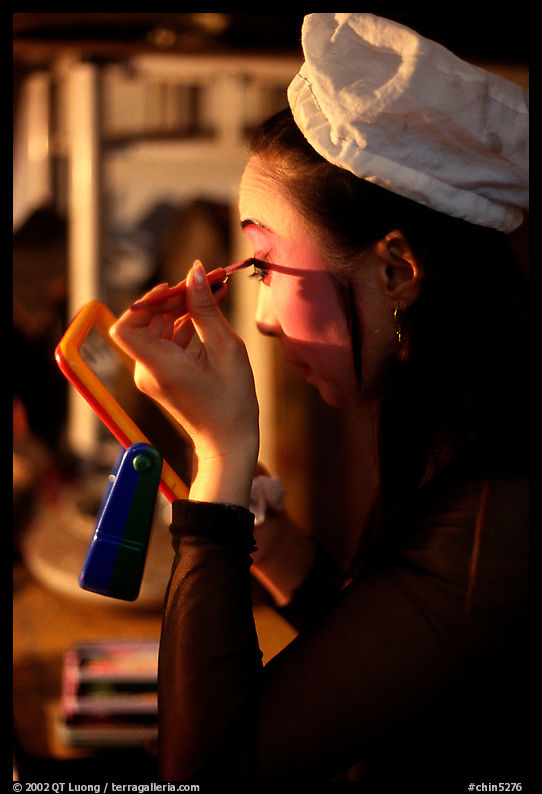 Sichuan opera actress applies makup. Chengdu, Sichuan, China
