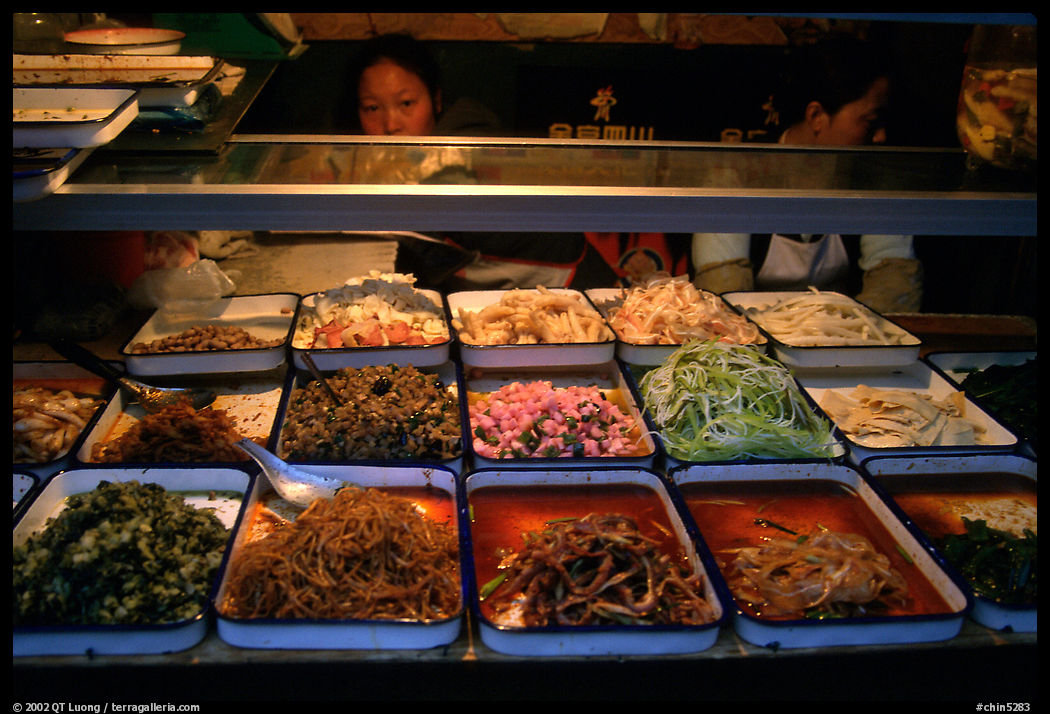 Food stall by night. Sichuan food is among China's spiciest. Chengdu, Sichuan, China