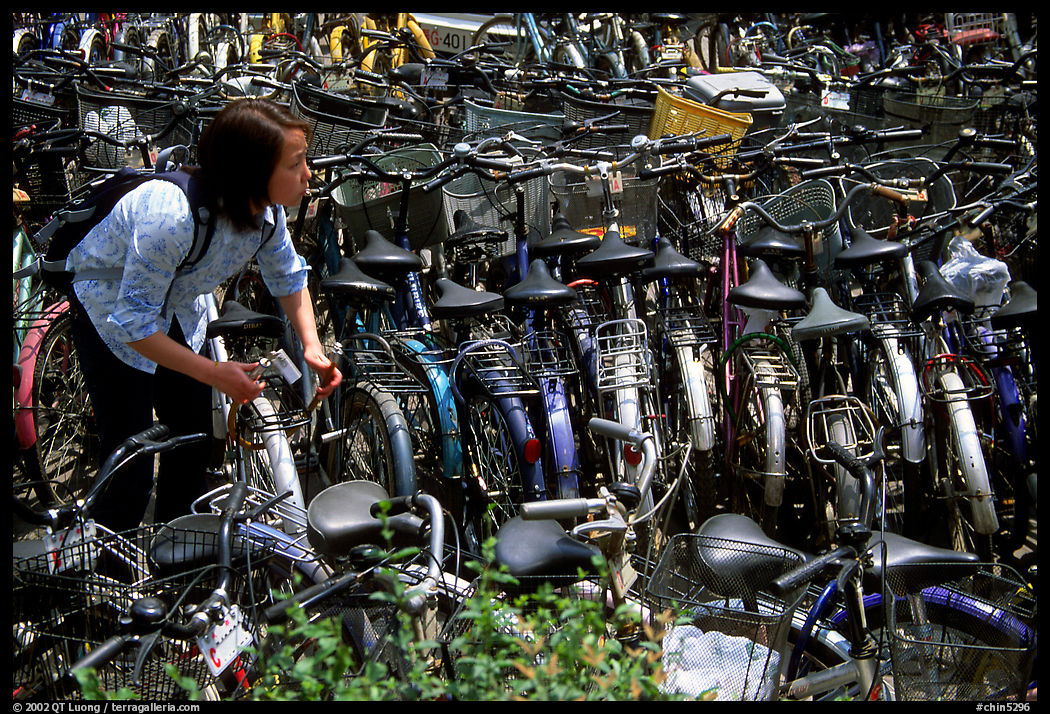 Retriving a bike in the bicycle parking lot. Chengdu, Sichuan, China