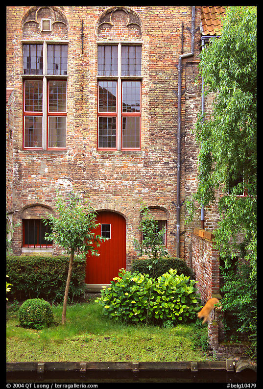 Brick house with small garden by the canal. Bruges, Belgium