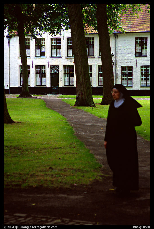 Benedictine nun in the Begijnhof. Bruges, Belgium