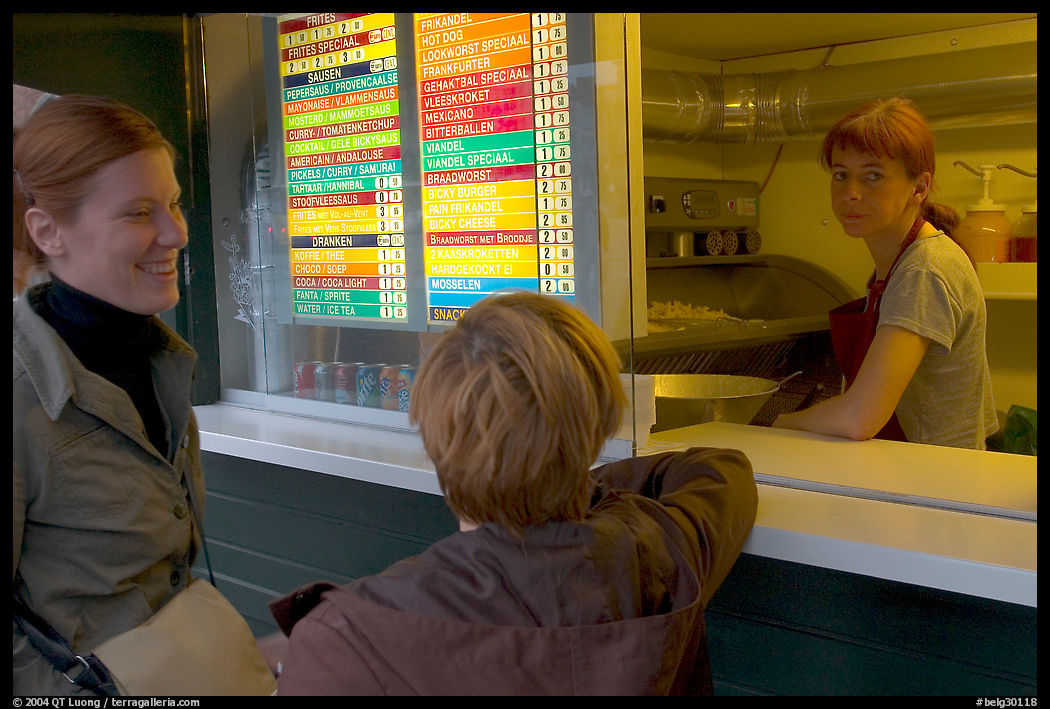 Women at a fries booth. Bruges, Belgium