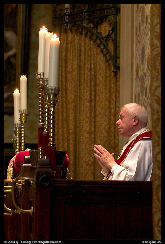 Priest in the the Basilica of Holy Blood. Bruges, Belgium