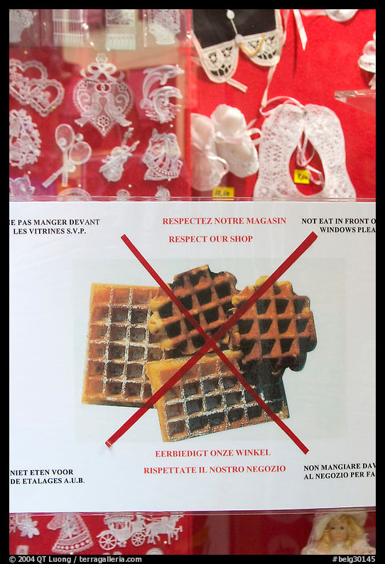 Sign in front of a lace store, prohibiting eating waffles. Brussels, Belgium