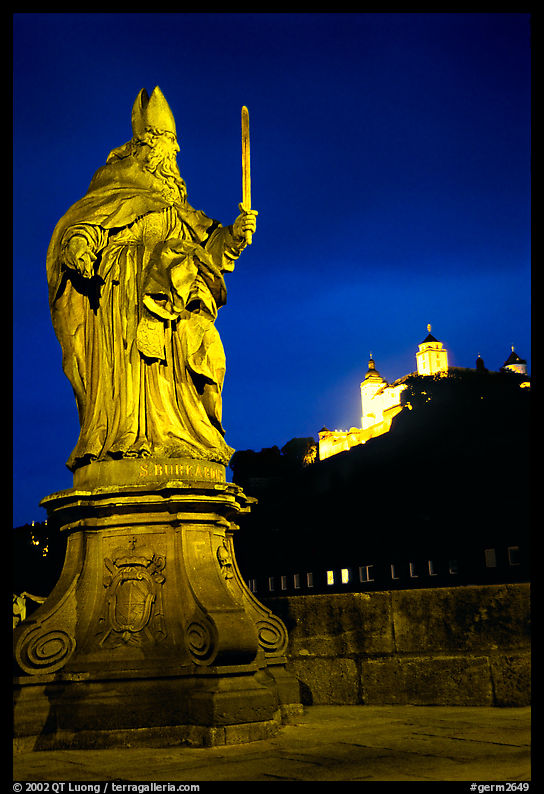 Saint Killian statue on  Alte Mainbrucke (bridge) and Festung Marienberg (citadel) at night. Wurzburg, Bavaria, Germany