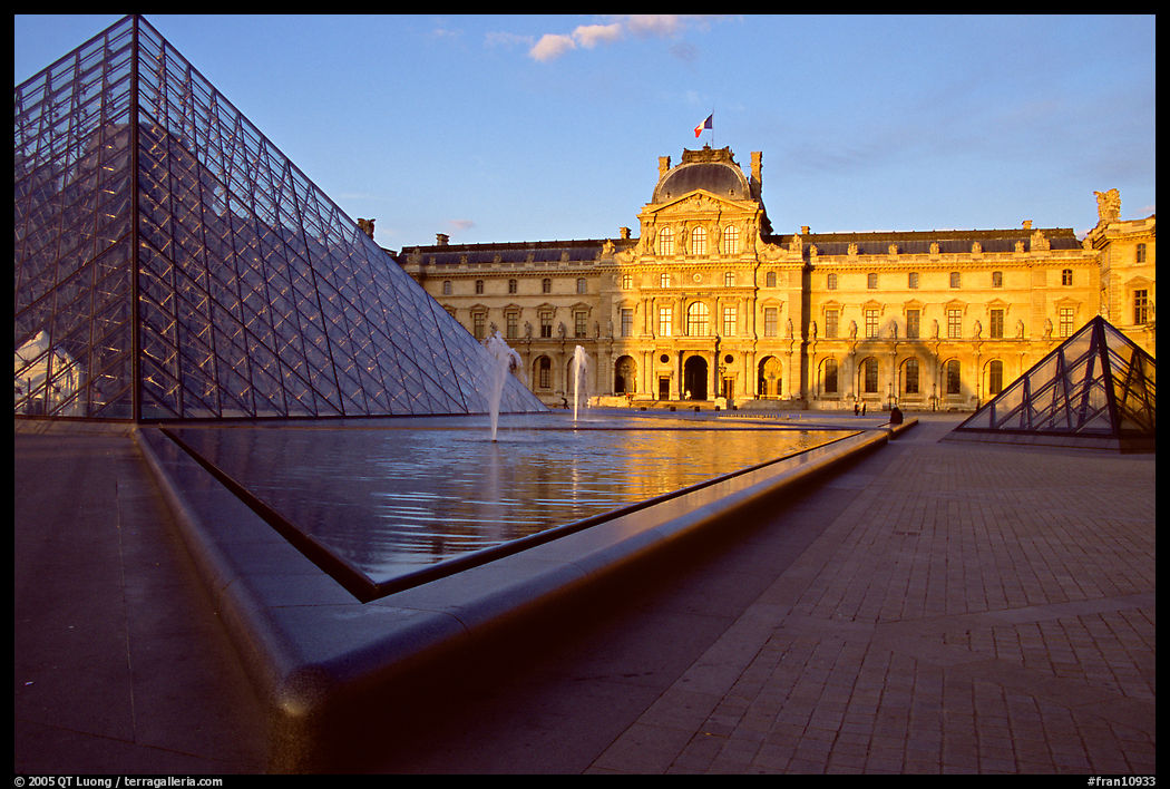 Pyramid and basins, and Sully Wing  in the Louvre, sunset. Paris, France