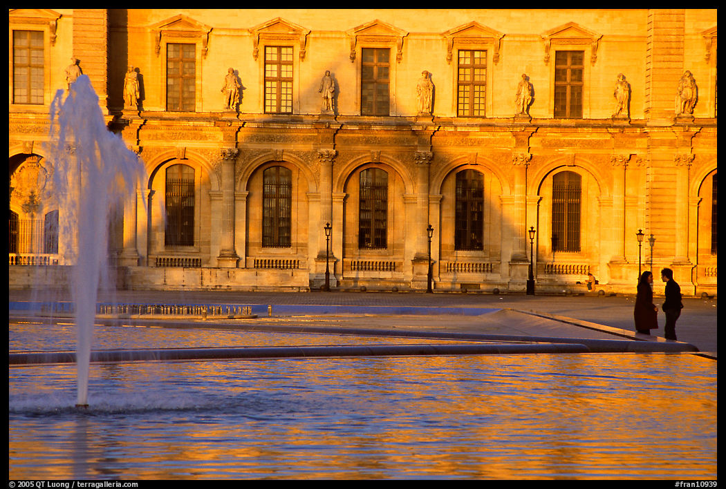 Basin and projected shadow of the Pei pyramid on the Louvre at sunset. Paris, France