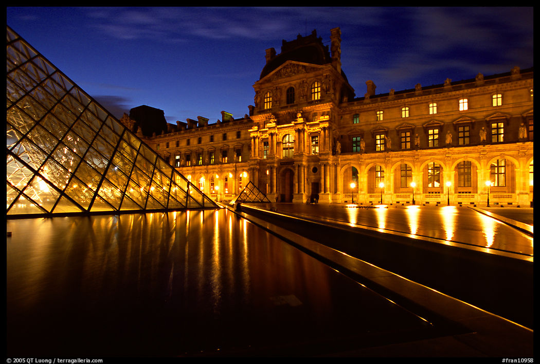 Basin, Pyramid, and Louvre at dusk. Paris, France