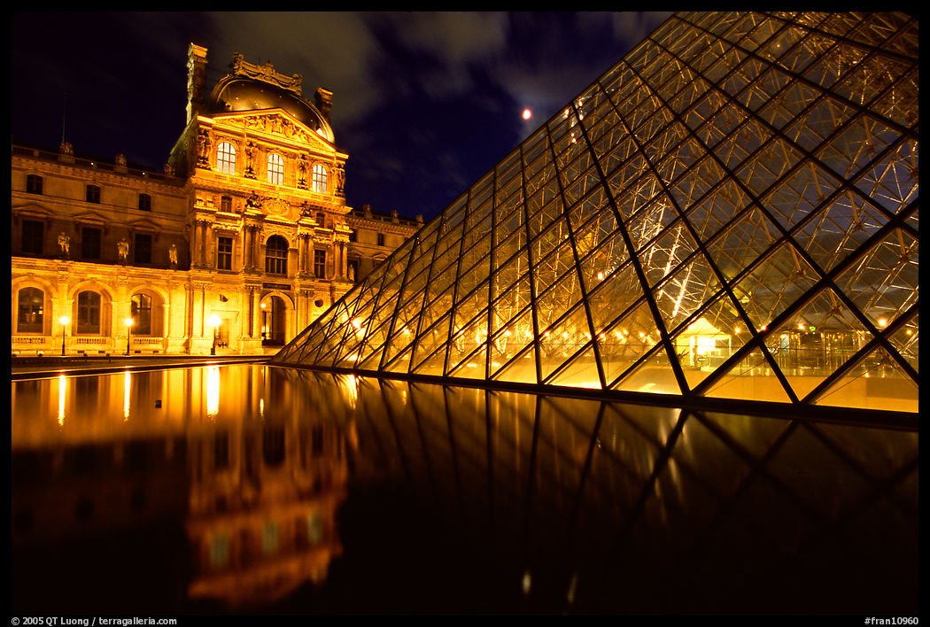 Louvre, Pyramid, basin,  at night. Paris, France
