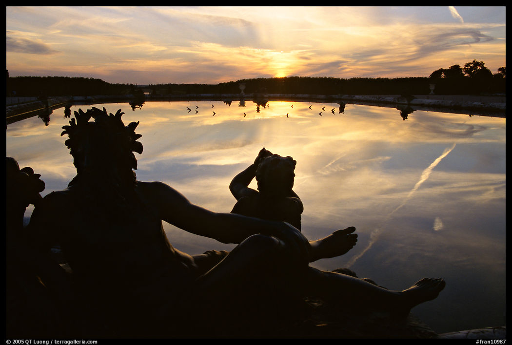 Sculpture and basin at sunset, Versailles Palace. France