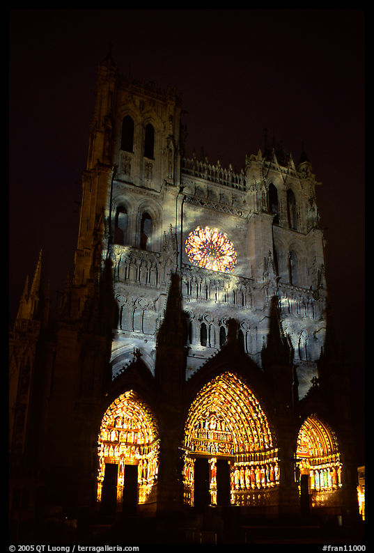 Cathedral facade illuminated at night, Amiens. France
