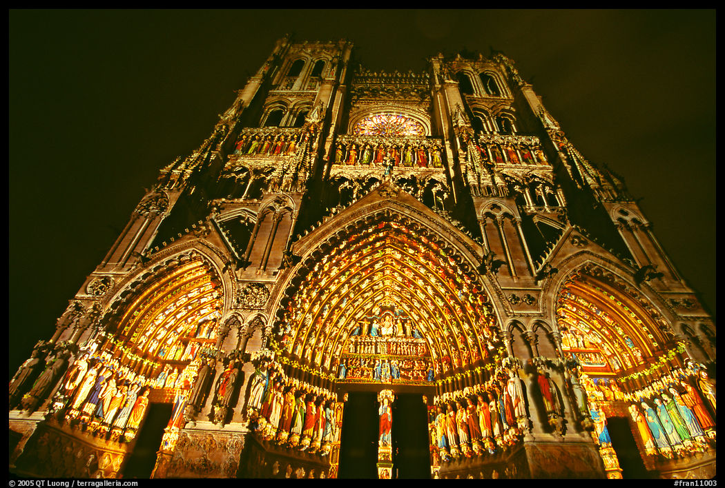 Looking up Notre Dame Cathedral laser-illuminated to recreate original colors, Amiens. France