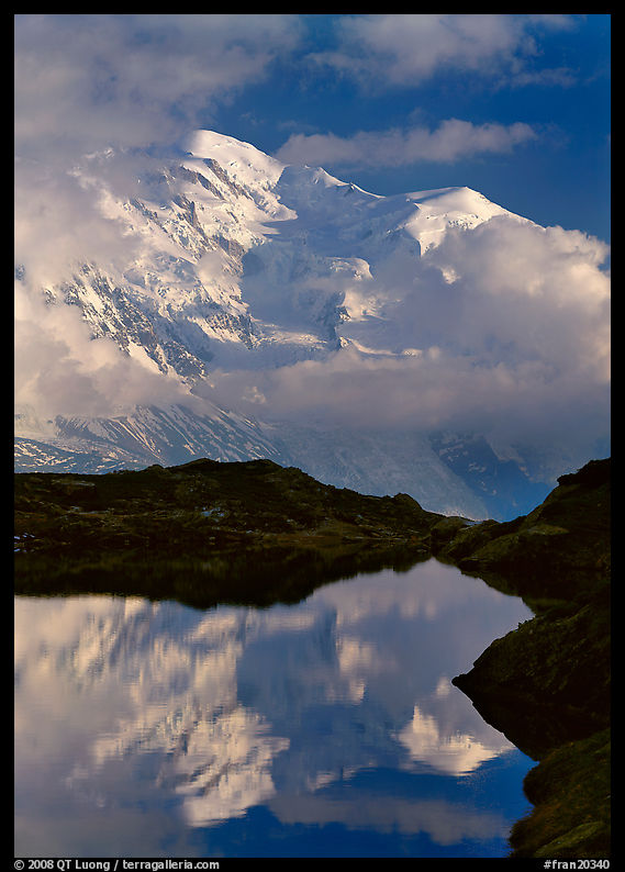 Mont Blanc and clouds reflected in pond, Chamonix. France