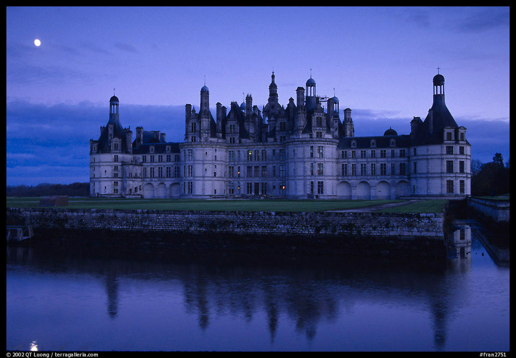 Chambord chateau at dusk with moonrise. Loire Valley, France