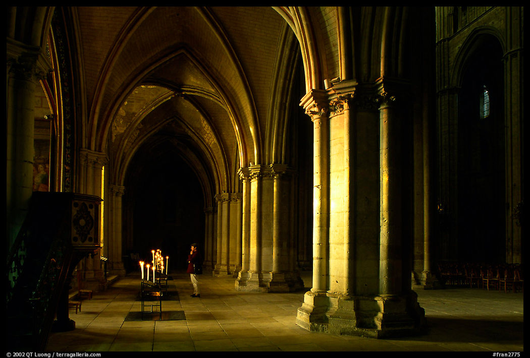 Worshiper inside the Saint-Etienne Cathedral. Bourges, Berry, France