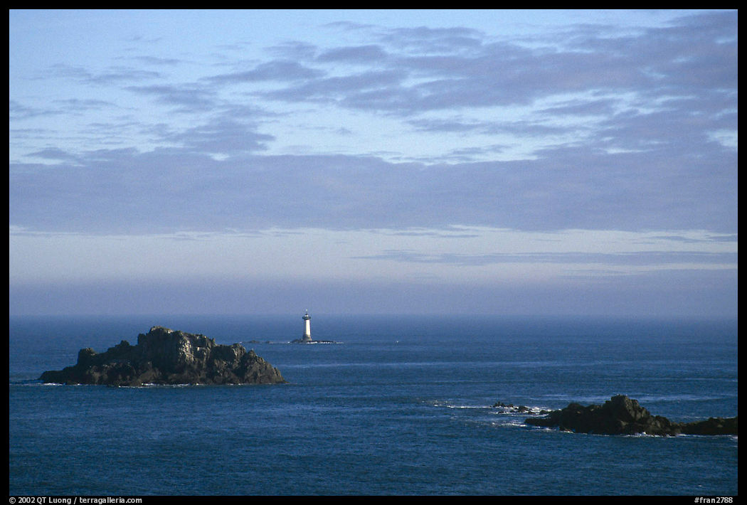 Islets and lighthouse on the coast. Brittany, France