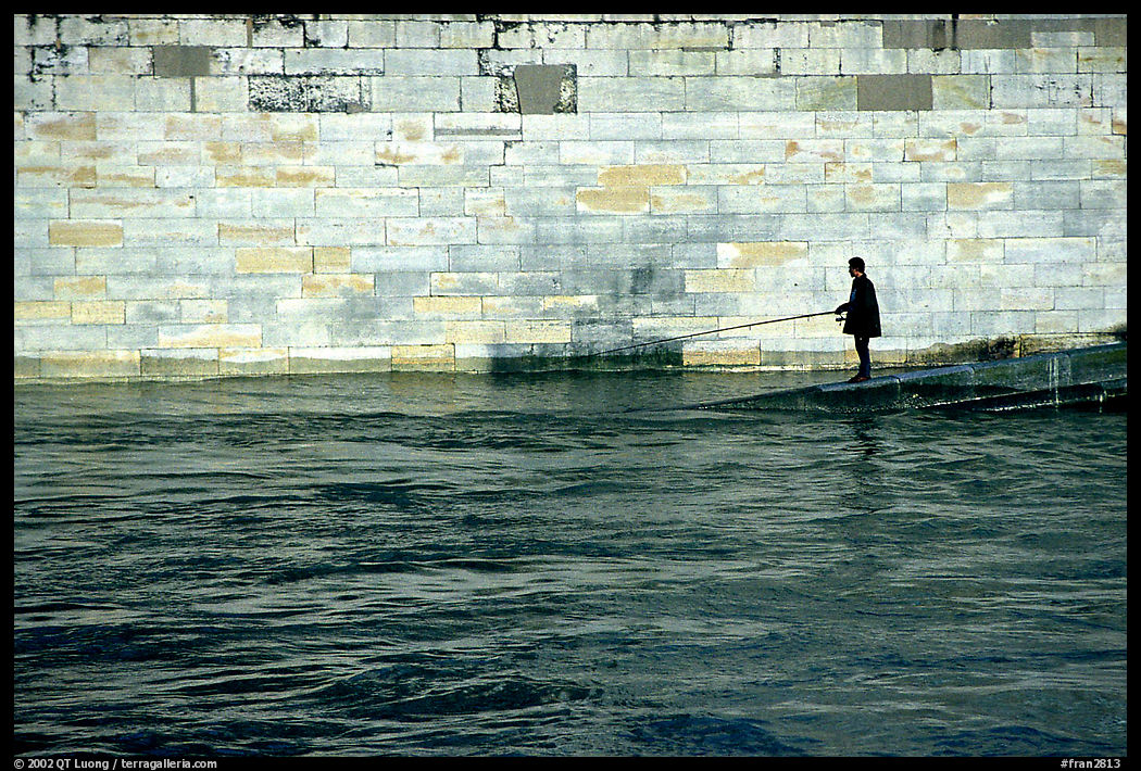 Fishing in the Seine River. Paris, France