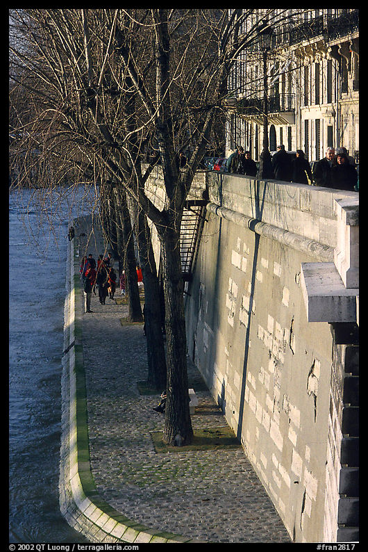 Walking on the banks of the Seine on the Saint-Louis island. Paris, France