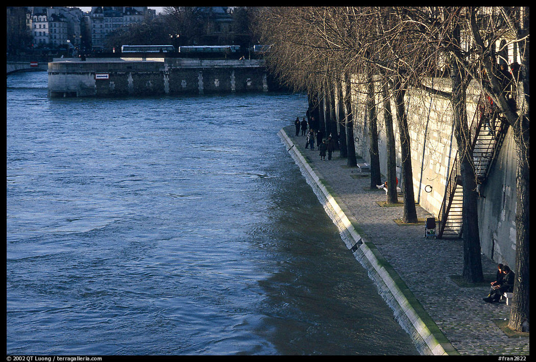 Walking on the banks of the Seine on the Saint-Louis island. Paris, France