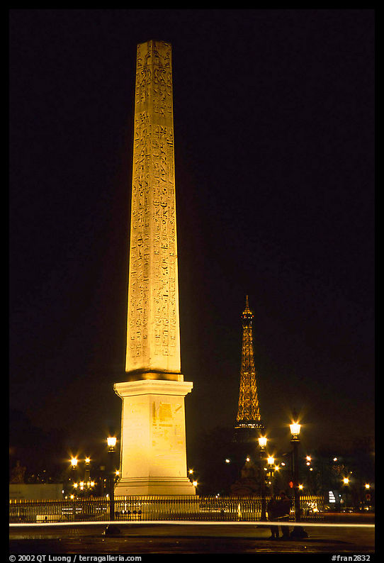 Luxor obelisk of the Concorde plaza and Eiffel Tower at night. Paris, France