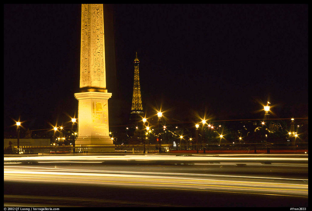 Luxor obelisk of the Concorde plaza and Eiffel Tower at night. Paris, France