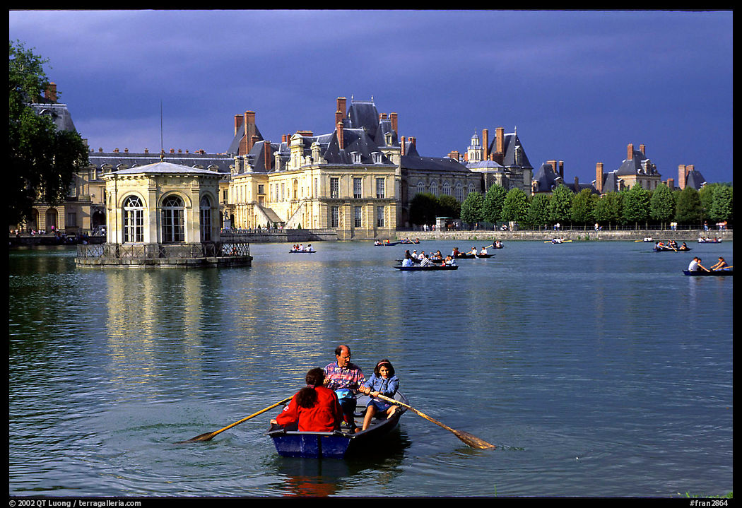 Rowers and Fontainebleau palace. France