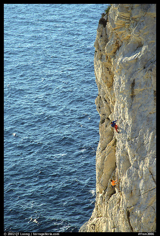 Rock climbing above water in the Calanque de Morgiou. Marseille, France