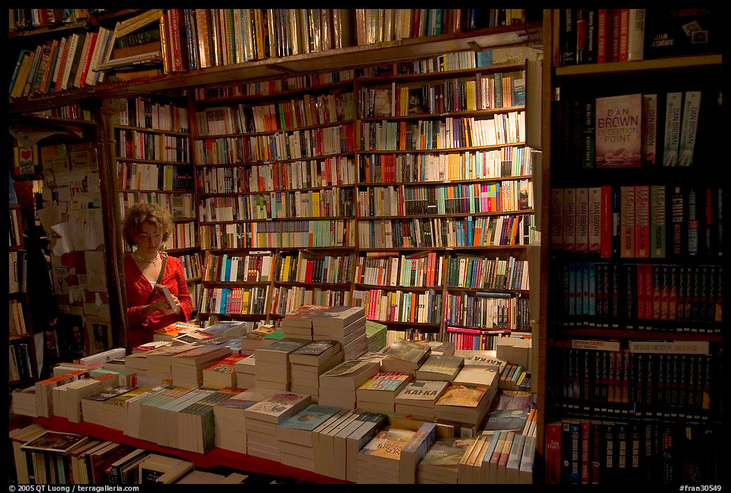 Checking a book in Shakespeare and Company bookstore. Paris, France