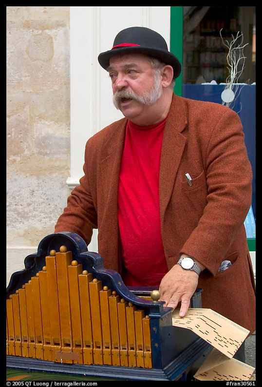 Street musician with Barrel organ. Paris, France