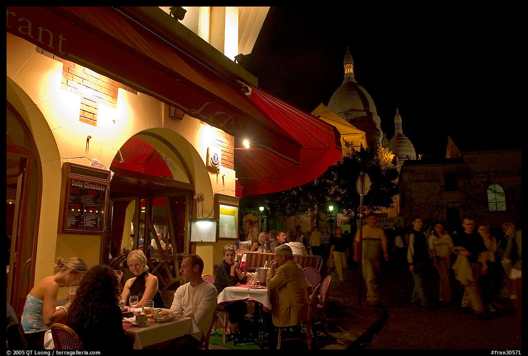 Outdoor restaurant at night on the Place du Tertre, Montmartre. Paris, France