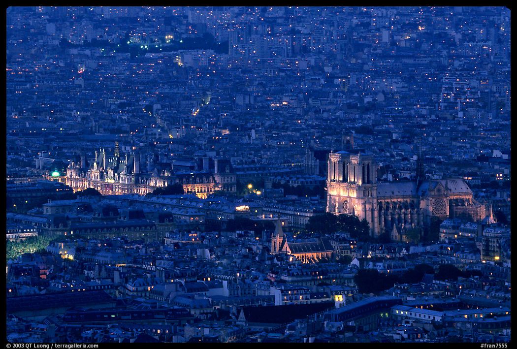 Hotel de Ville (City Hall) and Notre Dame seen from the Montparnasse Tower, dusk. Paris, France