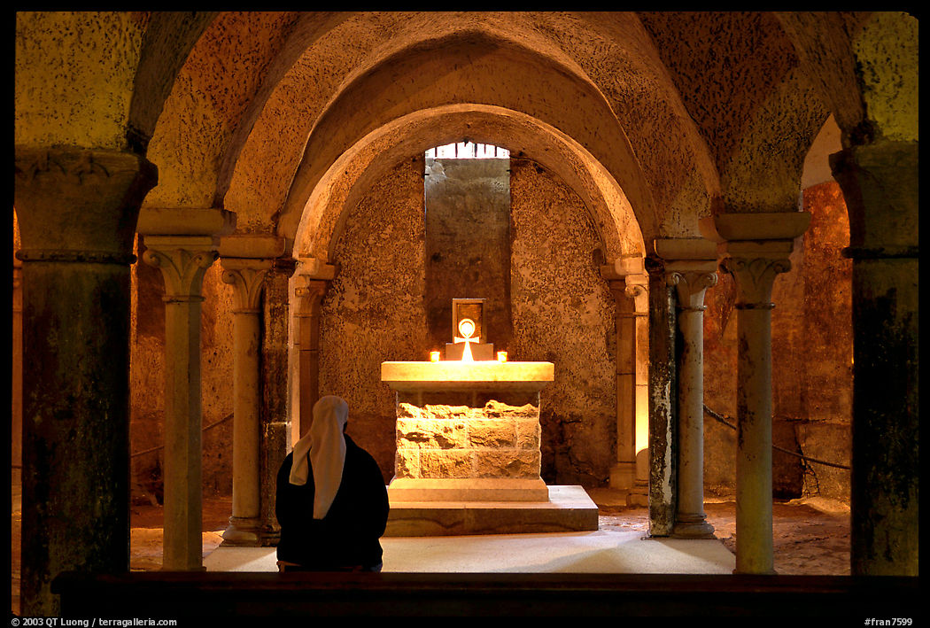 Crypte of the Romanesque church of Vezelay with Nun in prayer. Burgundy, France