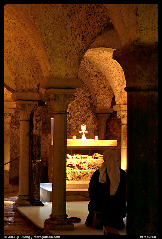 Nun in prayer in the Crypte of the Romanesque church of Vezelay. Burgundy, France