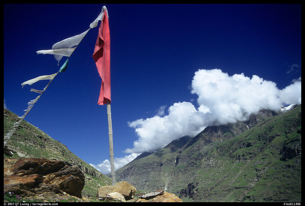 Prayer flag and cloud-capped peak, Himachal Pradesh. India