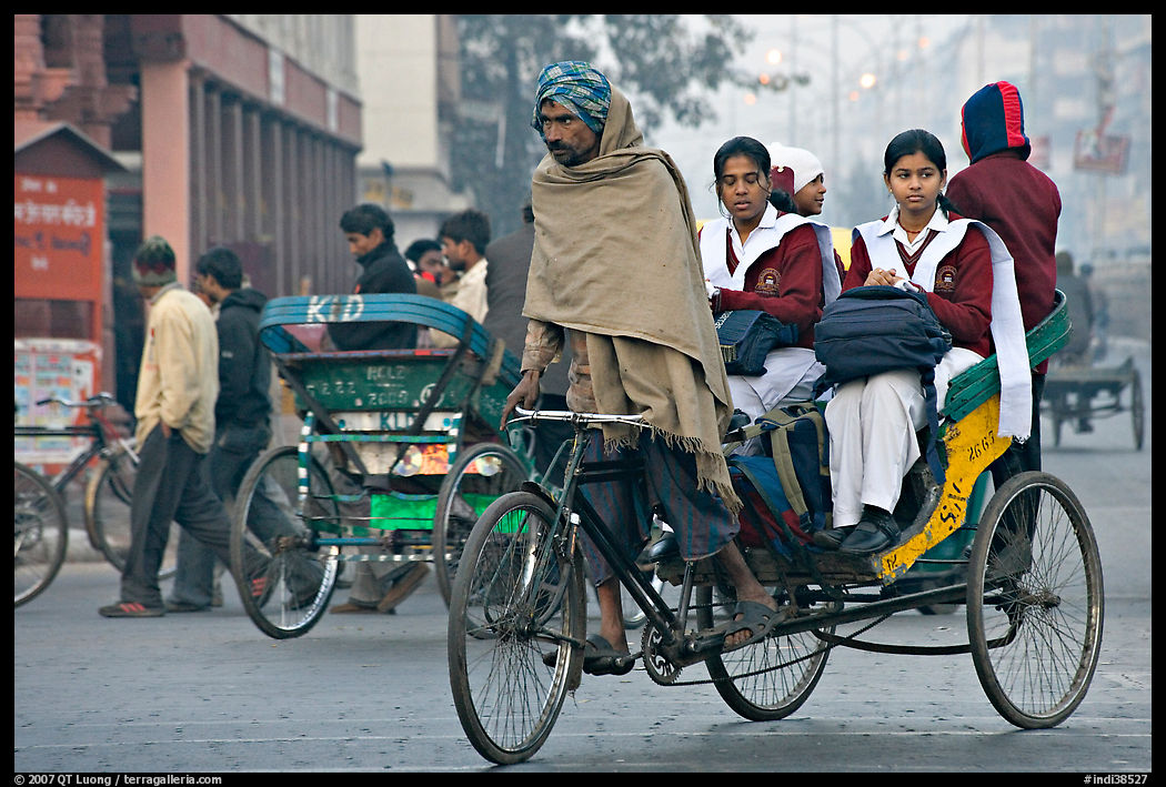Cycle-rickshaw carrying uniformed schoolgirls. New Delhi, India