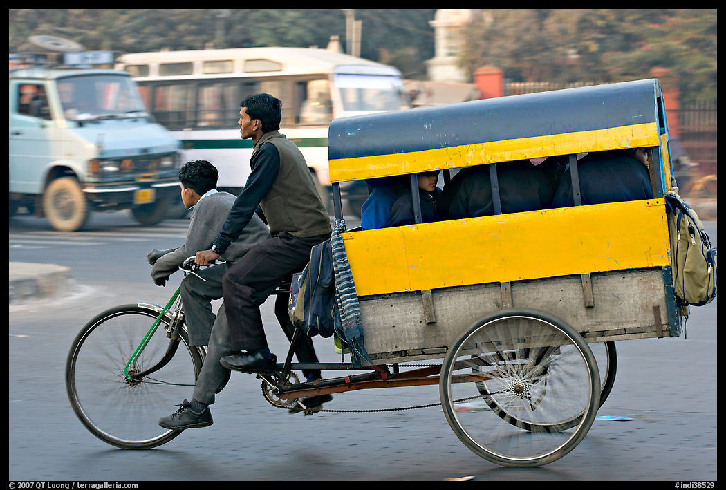 Cycle-rickshaw pulling a box for carrying schoolchildren. New Delhi, India