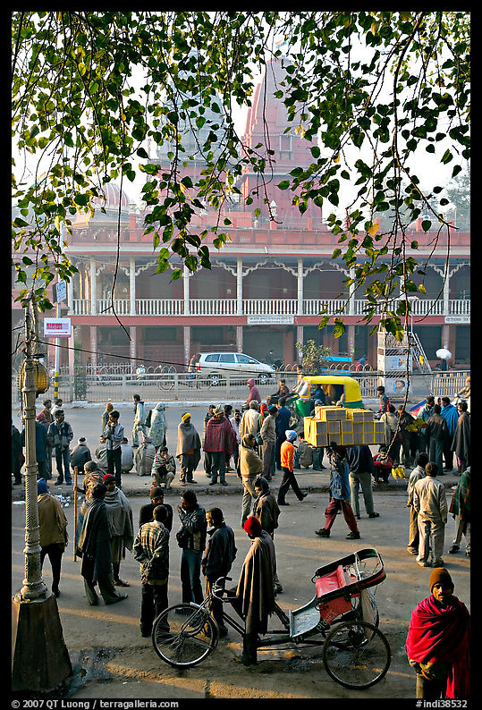 Side alley with a lot people hanging out. New Delhi, India