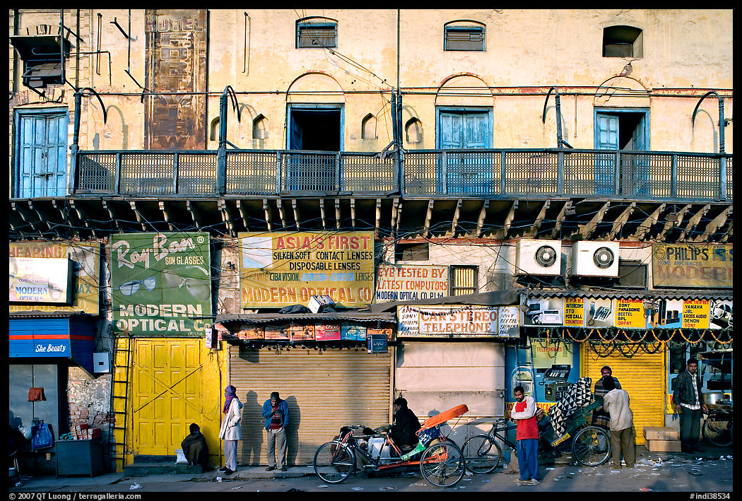 Street with old buildings and storefronts closed, Old Delhi. New Delhi, India