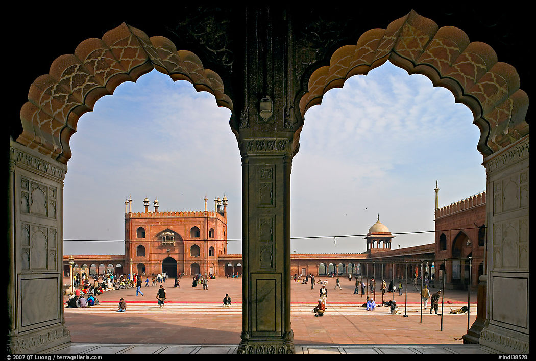 Courtyard of mosque seen through arches of prayer hall, Jama Masjid. New Delhi, India