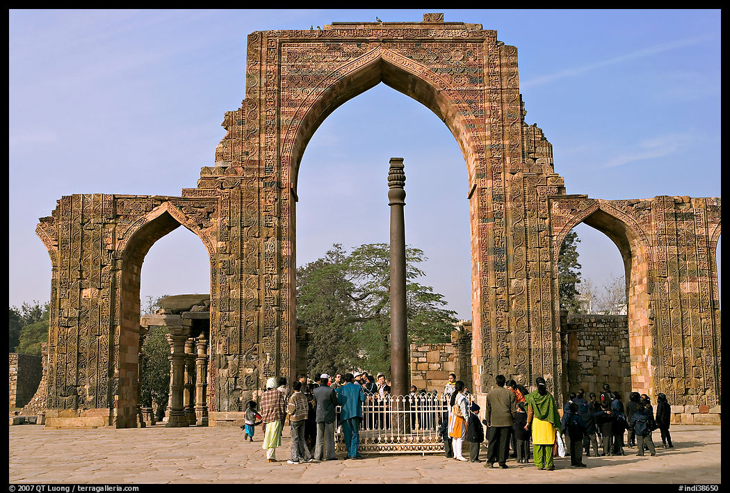 Iron pillar, and ruined mosque arch, Qutb complex. New Delhi, India