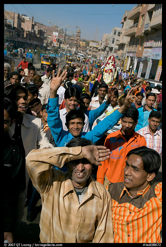 Young men walking in front of groom during a wedding procession. Jodhpur, Rajasthan, India