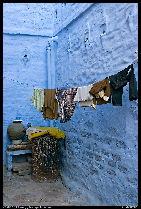 Laundry in alley with whitewashed walls tinted indigo. Jodhpur, Rajasthan, India
