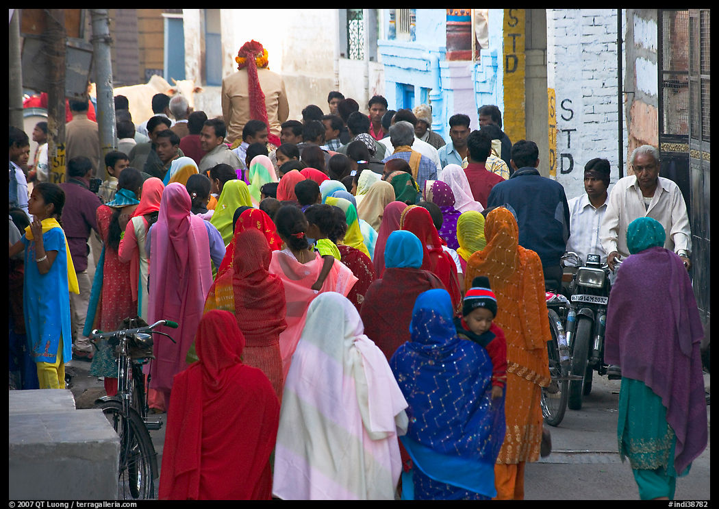 Women in colorful sari in a narrow street during wedding. Jodhpur, Rajasthan, India
