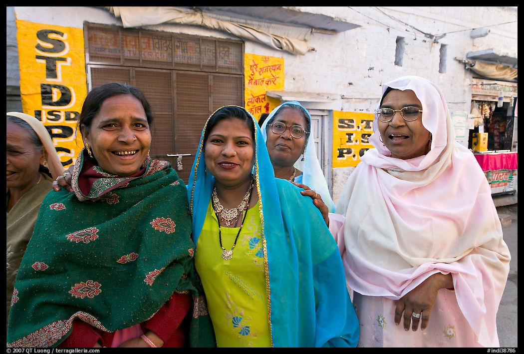Women wearing hijabs smiling in the street. Jodhpur, Rajasthan, India
