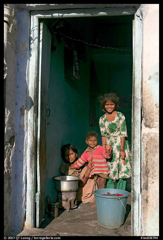 Family inside doorway. Jodhpur, Rajasthan, India