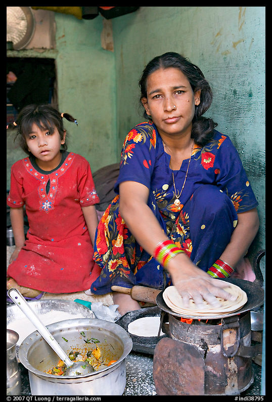 Woman and girl preparing chapati bread. Jodhpur, Rajasthan, India