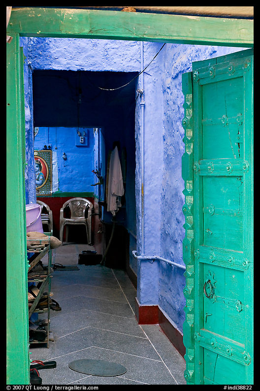Doorway and inside of a house painted blue. Jodhpur, Rajasthan, India