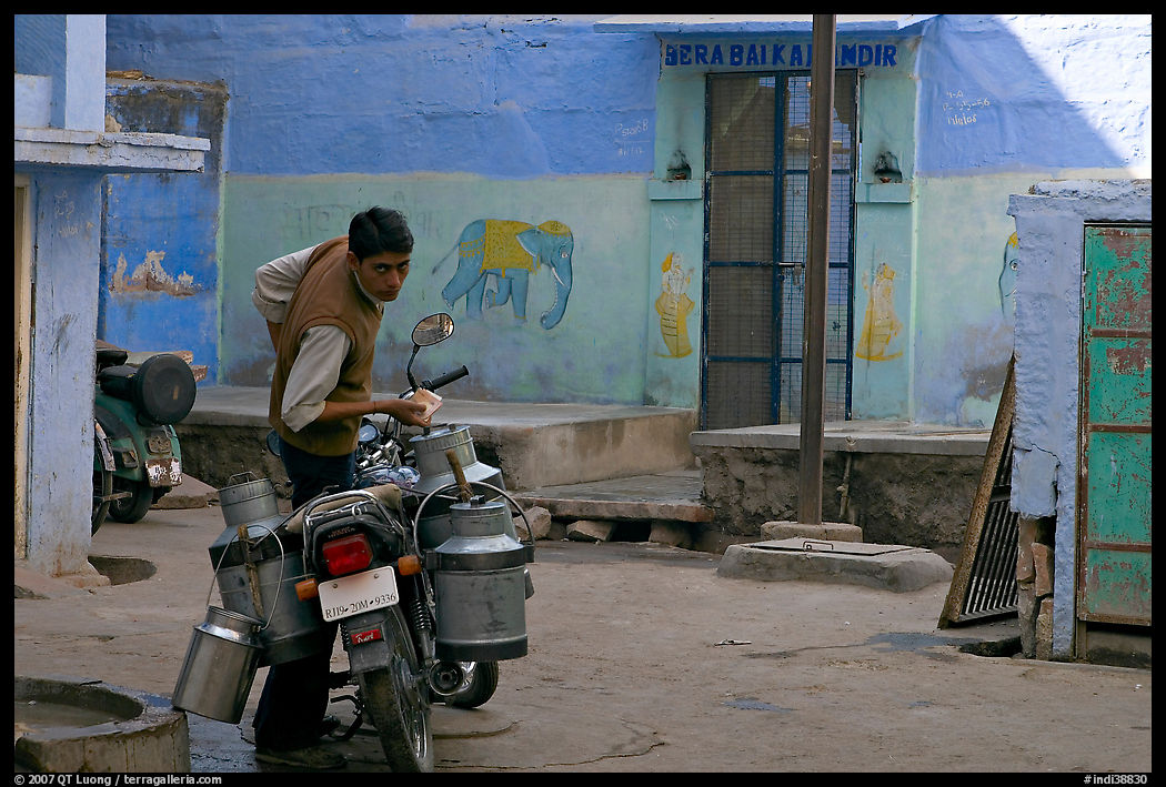 Man with milk delivery motorbike. Jodhpur, Rajasthan, India