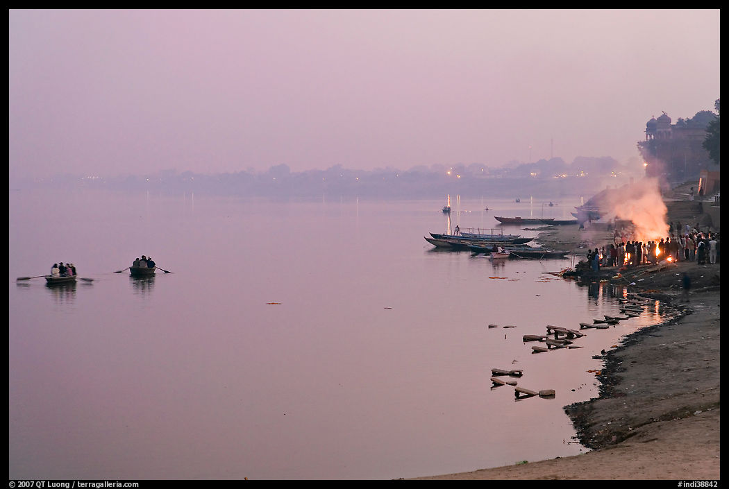 Ganges River at sunset with cremation fire. Varanasi, Uttar Pradesh, India