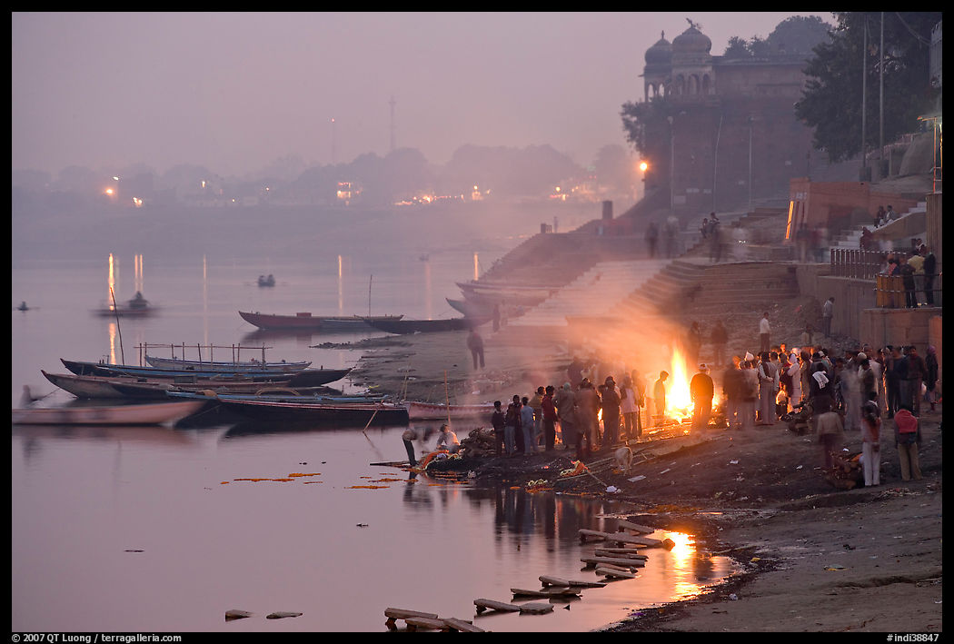 Cremation fire on banks of Ganges River. Varanasi, Uttar Pradesh, India